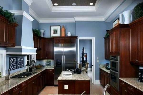 Blue Walls With Brown Kitchen Cabinets