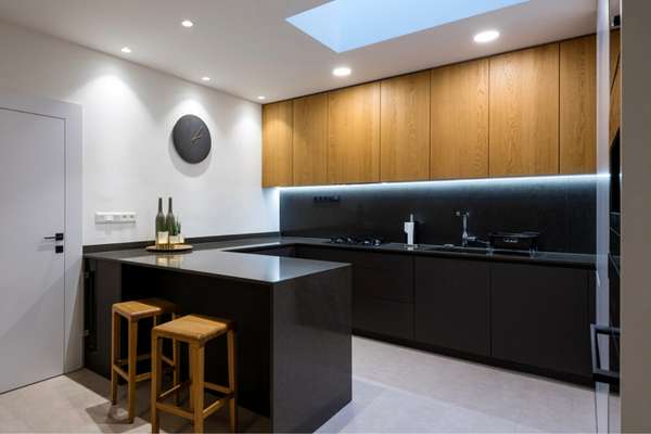 Brown Cabinets With Black Kitchen