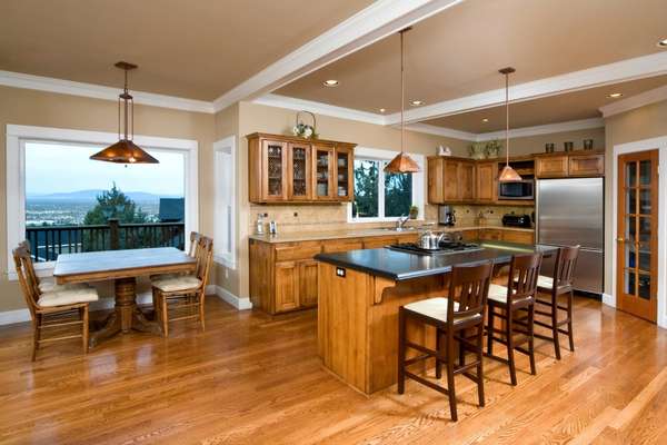 Brown Kitchen Cabinets With Wood Flooring