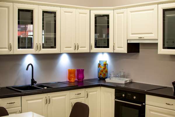 Kitchen With White Cabinets And Black Countertops