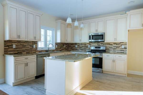 Quartzite Floor Tile With White Cabinets