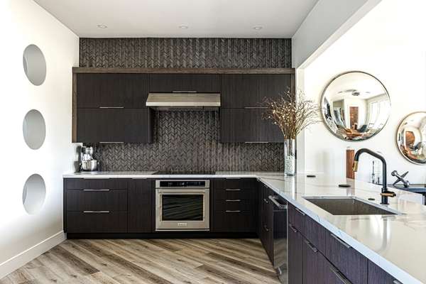 kitchen with white cabinets and black countertop